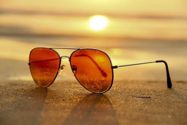 glasses lying on the sand
